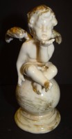 Los  <br>Putto auf Kugel, Gold stark berieben, um 1930, H-14 cm