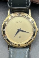 Auktion 347 / Los 2048 <br>Damenarmbanduhr "Gucci" Nr. 028-581, vergoldet, Lederband, Quartz