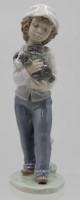 Auktion 348 / Los 8169 <br>Figur, Junge mit Hund, NAO Spain, Unterglasurfarben, H-20cm.