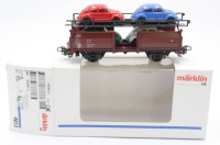 Auktion 349 / Los 12051 <br>Güterwaggon mit 4 VW-Käfern, Märklin, H0, orig. Karton