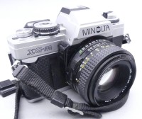 Auktion 352 / Los 16021 <br>Spiegelreflex "Minolta XG-M" mit Objektiv und Beschreibung