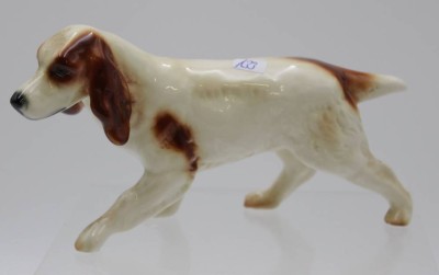 Auktion <br>Hunde-Figur, Cortendorf, polychr. Bemalung, ca. H-9cm L-16,5cm. [1]