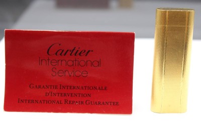 Auktion 354<br>CARTIER VINTAGE Feuerzeug, anbei Serviceheft, leichte Gebrauchsspuren, ca. L-7cm [1]