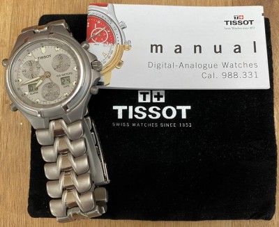 Auktion 354<br>Tissot Titanium , Referenz T670 in Tasche und Heftchen, sehr gut erhalten, läuft (Batterie jetzt leer), ca. D-4cm [1]