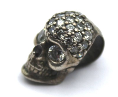 Auktion 355<br>925er Silber-Totenkopf-Anhänger, besetzt mit klaren Steinen (1x fehlt), 5,6gr., L-2cm [1]